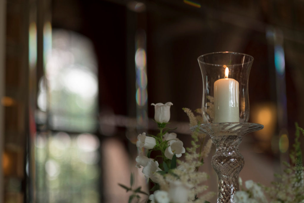 Hurricane lamp and flowers