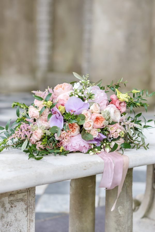 Wedding bouquet using pale pink, lilac and blush roses at Wotton House