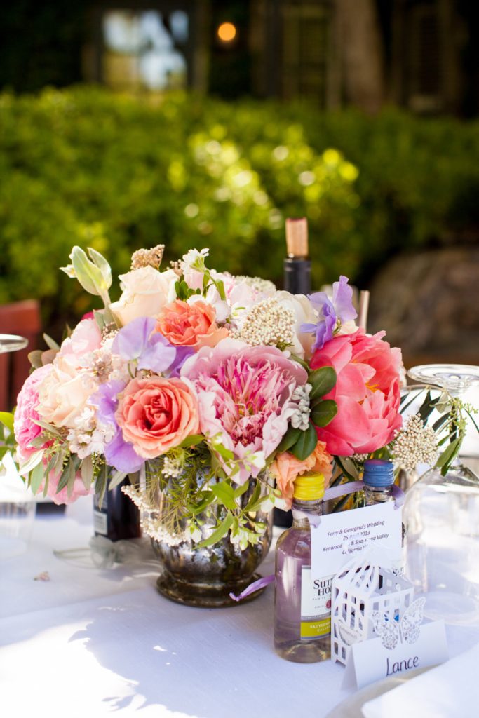 Blush and coral wedding centrepiece for table