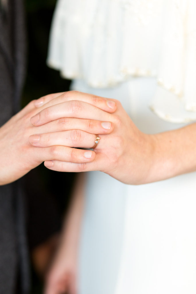 Bride and groom holding hands