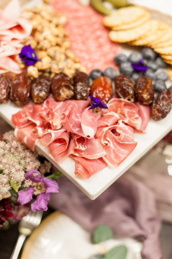 grazing table of mixed meats by the curated kitchen