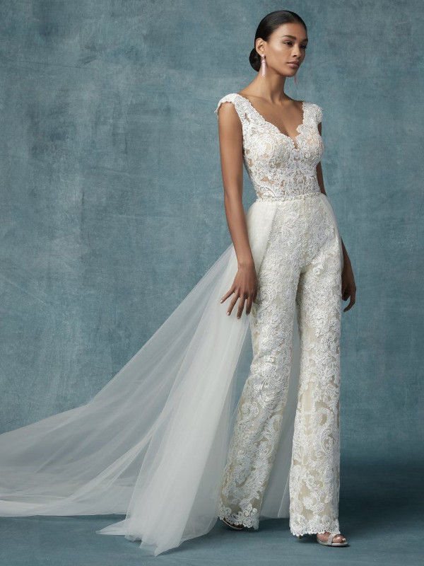 Maggie Sottero Milan fitted jumpsuit wedding dress with allover lace on top of tulle