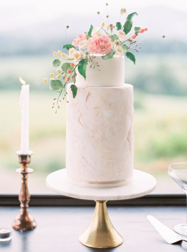2 tier wedding cake with delicate details and fresh flowers