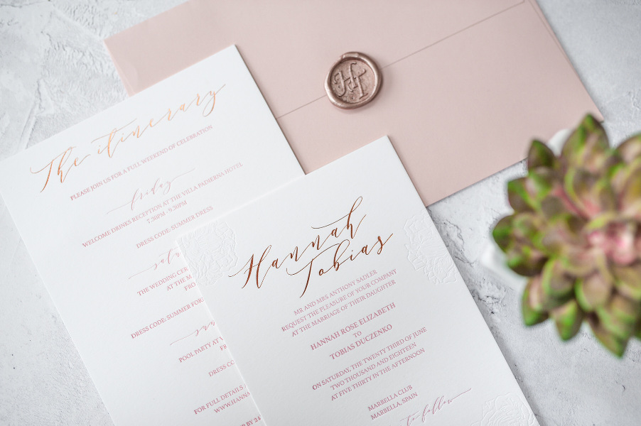 Blush and white wedding invitations with calligraphy
