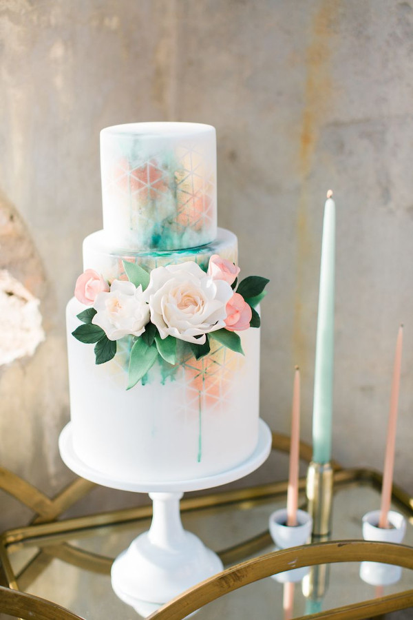 Textured 3 tier wedding cake with flower detail and tones of mint green and rose gold