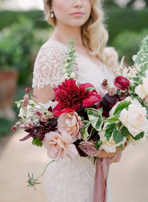 Bride bouquet featuring spring peonies and foxglove, as well as lush summer garden roses