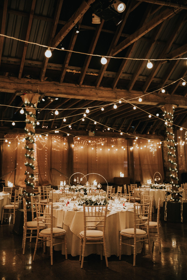 Festooned fairy lights wrapped around pillars and suspended from the ceiling