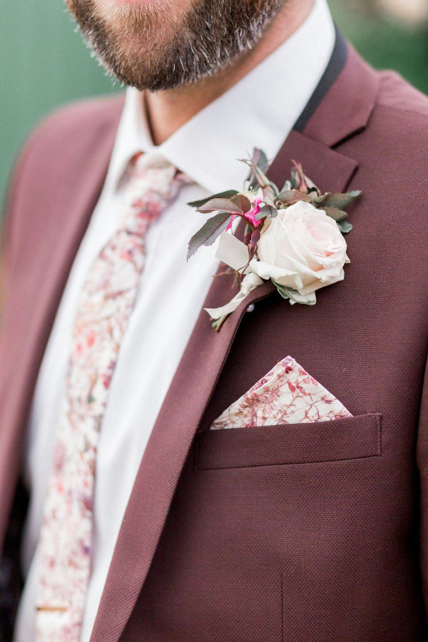 Groom wedding suit in light burgundy with tie and pocket square