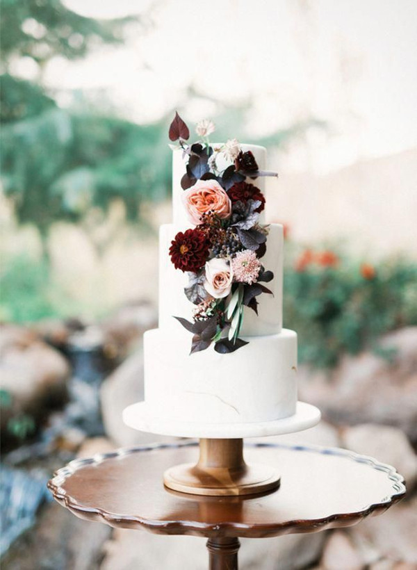 3 tier wedding cake with blush and burgundy flowers