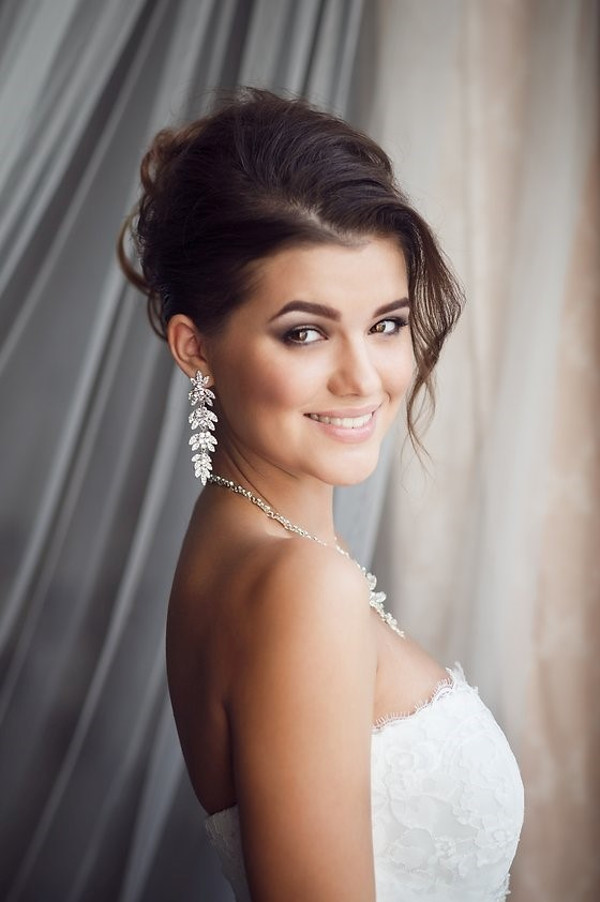 Bride with professional hair and make up and crystal earrings