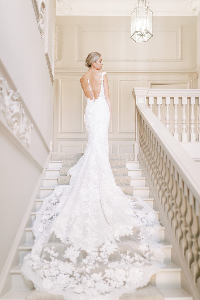 Bride on sweeping staircase