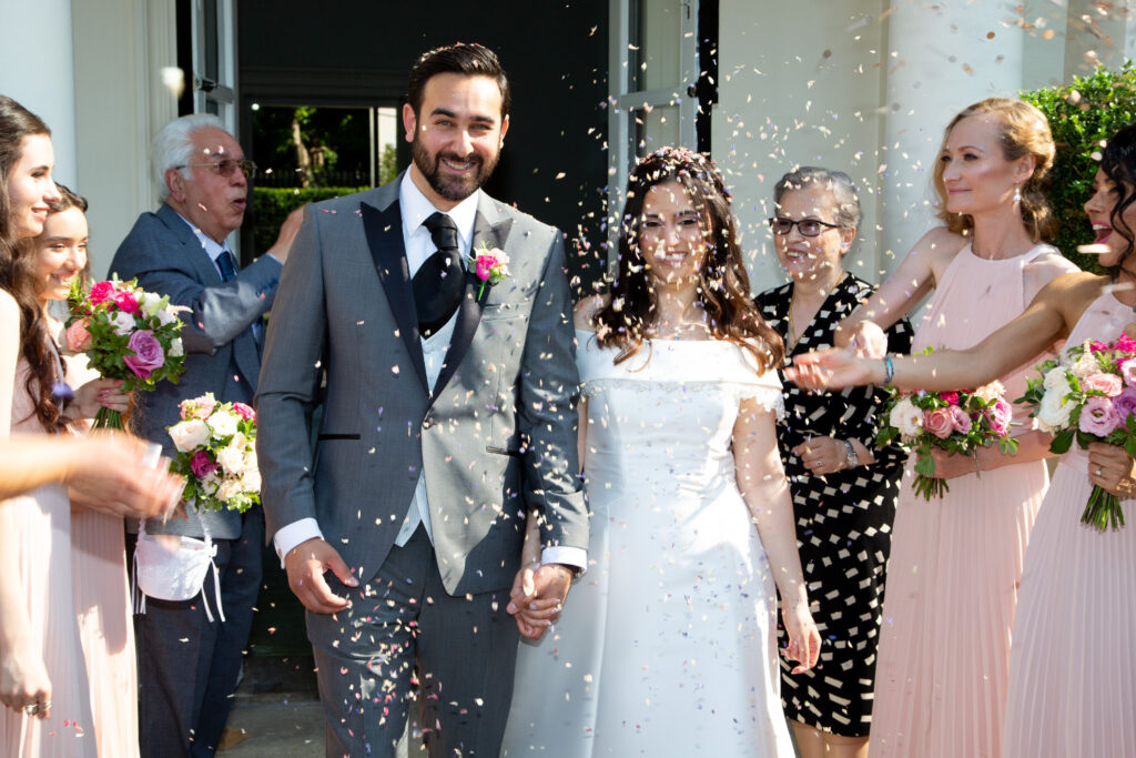 Bride and groom confetti shot Persian wedding at Morden Hall