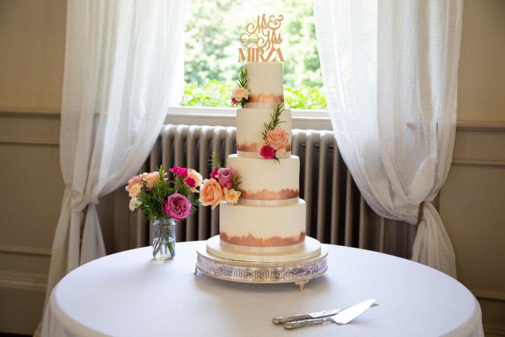 4 tier rose gold wedding cake with fresh flower decoration