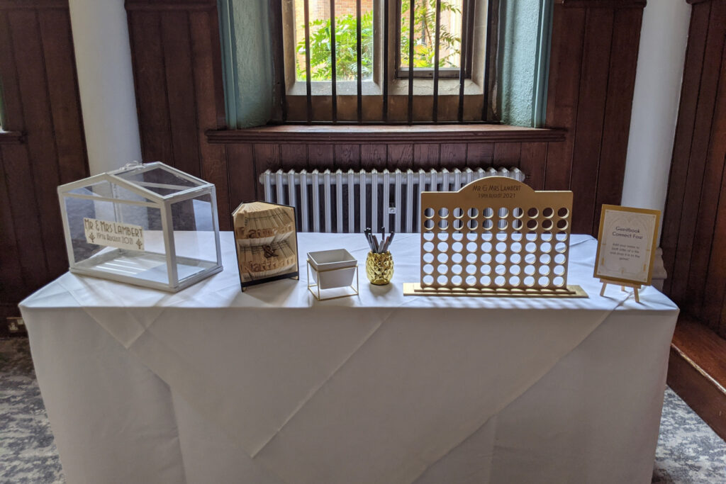 Table with wedding post box and connect 4