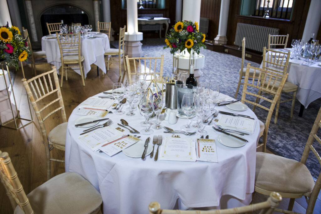 Wedding table with table cloth and favours