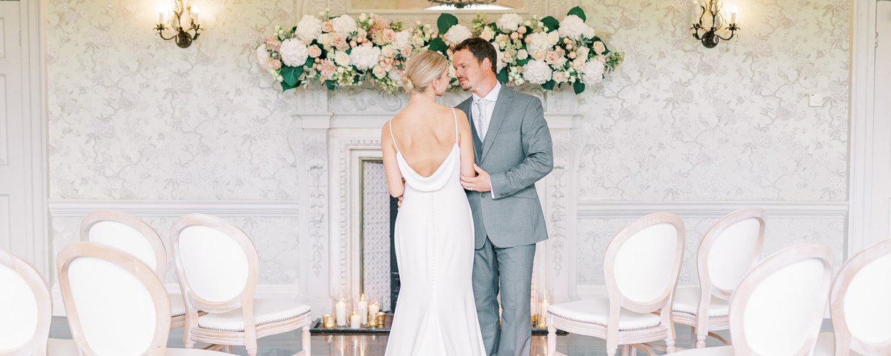 Wedding ceremony set up with couple, floating flowers and candles