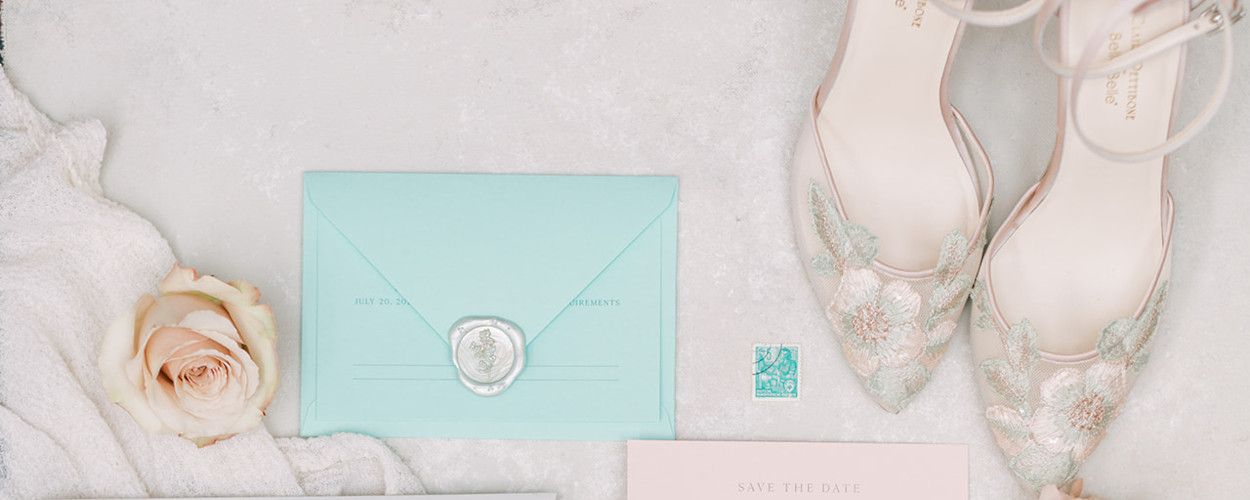 Blush and mint wedding stationery and bridal shoes