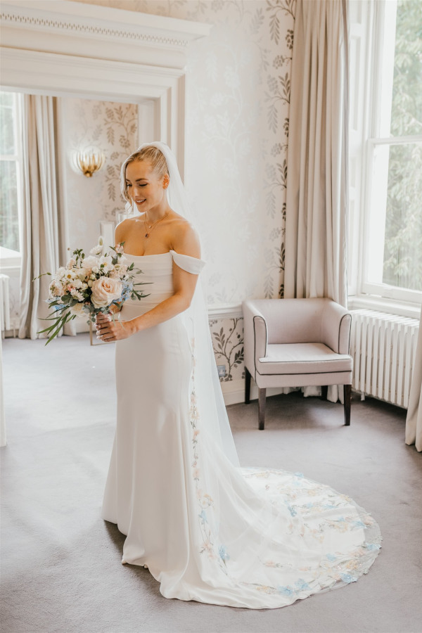 Bride holding blush pastel bouquet at Morden Hall
