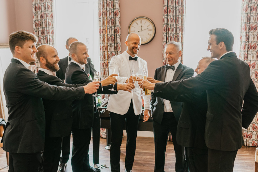 Groomsmen toasting with Groom at Morden Hall