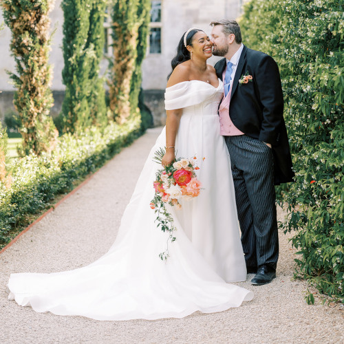 Bride and groom holding bouquet at Elmore Court Gloucester