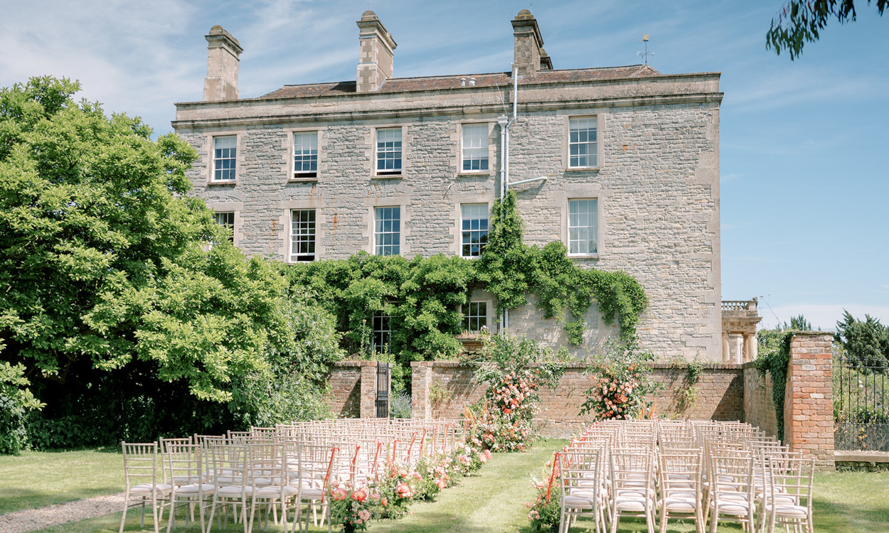 Elmore Court outdoor wedding ceremony coral peach decor