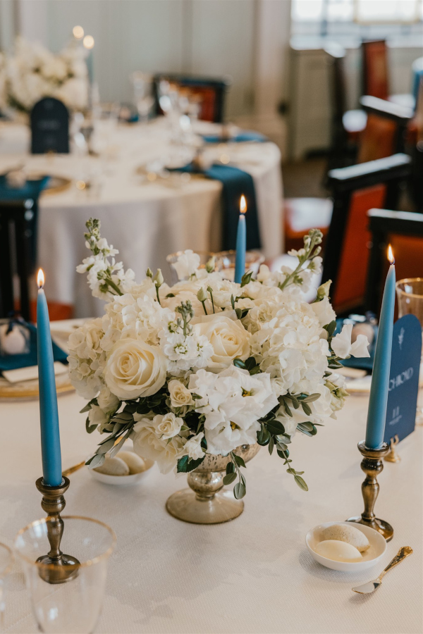 White and blush flowers on wedding table