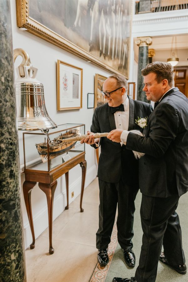 Couple ringing bell at trinity house