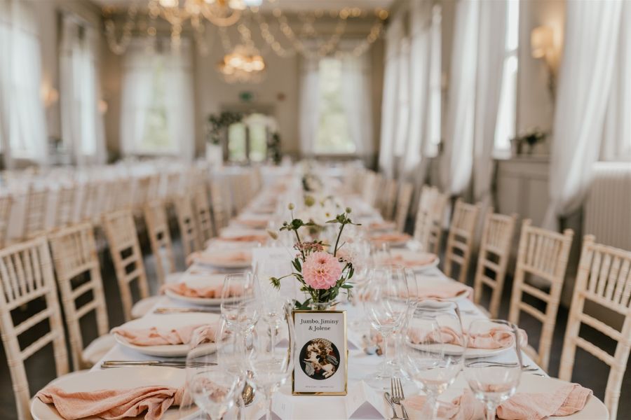 Wedding reception at morden hall with long tables and blush details