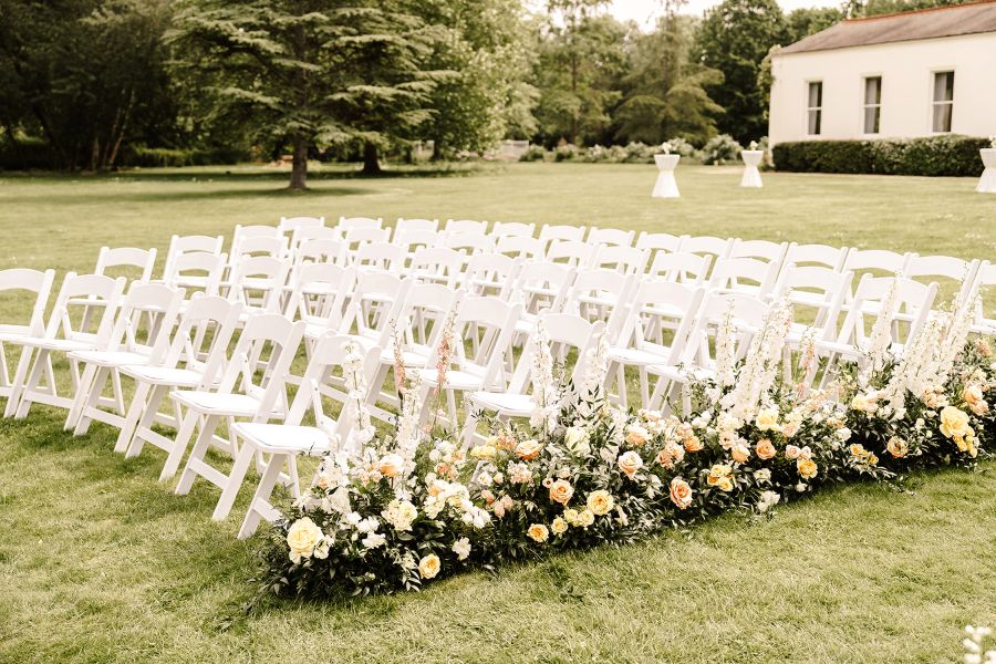 Outdoor ceremony morden hall with flower meadows along aisle
