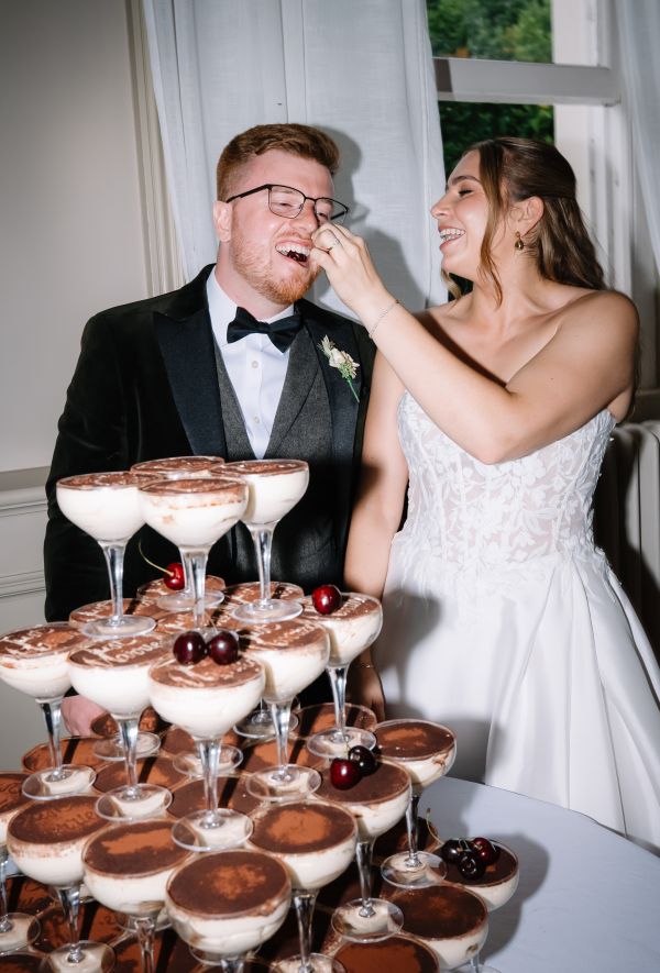 Bride and groom with tiramisu tower