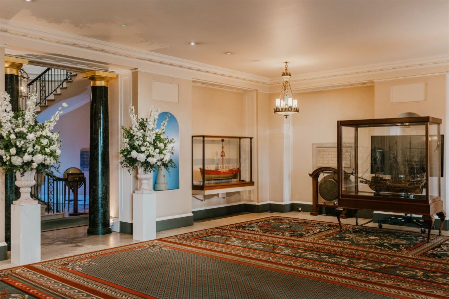 Welcome area Trinity House London with white fower pillar arrangements
