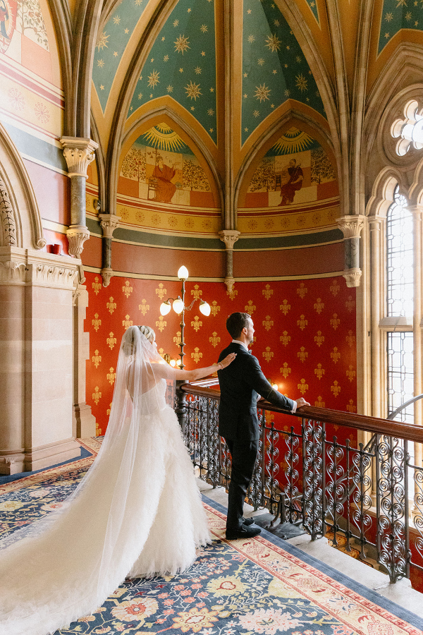 Couple first look on staircase at St Pancras London hotel